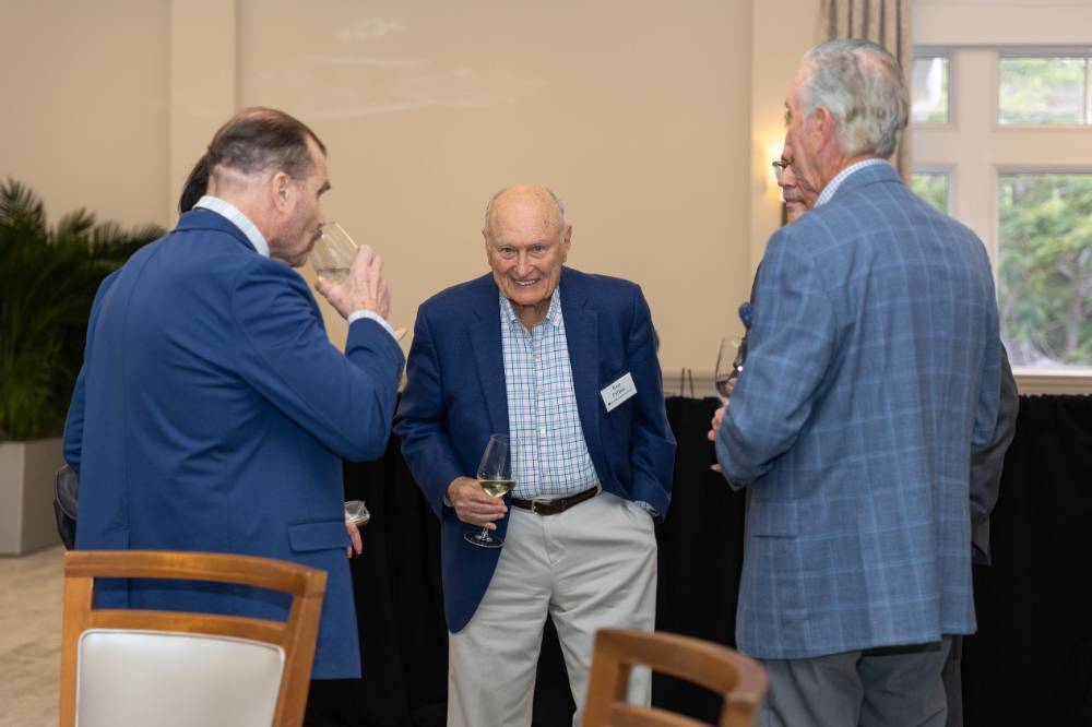 Ron Dalman in conversation with several other guests